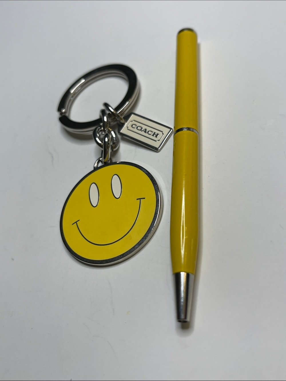 COACH Yellow Smiley Face Keychain and Coach Pen - Picture 2 of 5